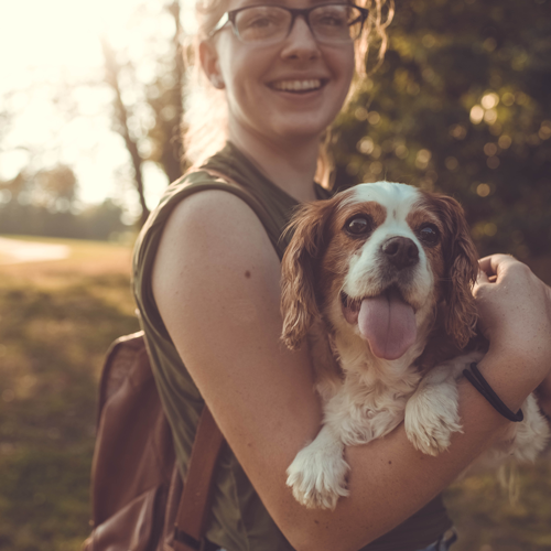 Woman holding a Dog